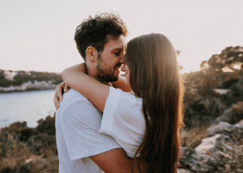 Couple embracing at sunset to rebuild emotional connection in their relationship.