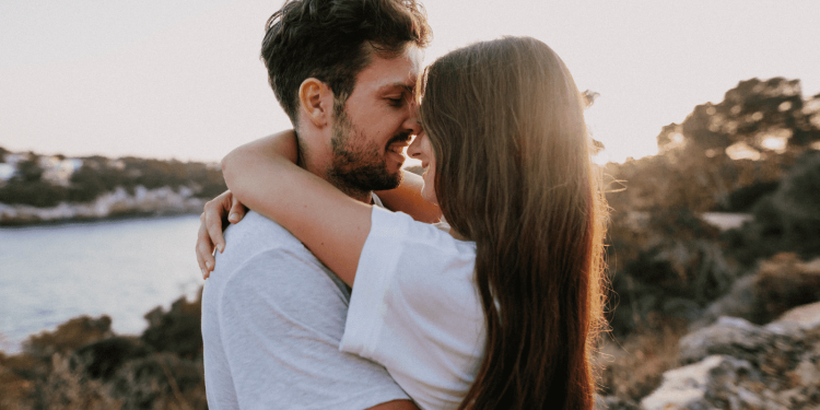 Couple embracing at sunset to rebuild emotional connection in their relationship.